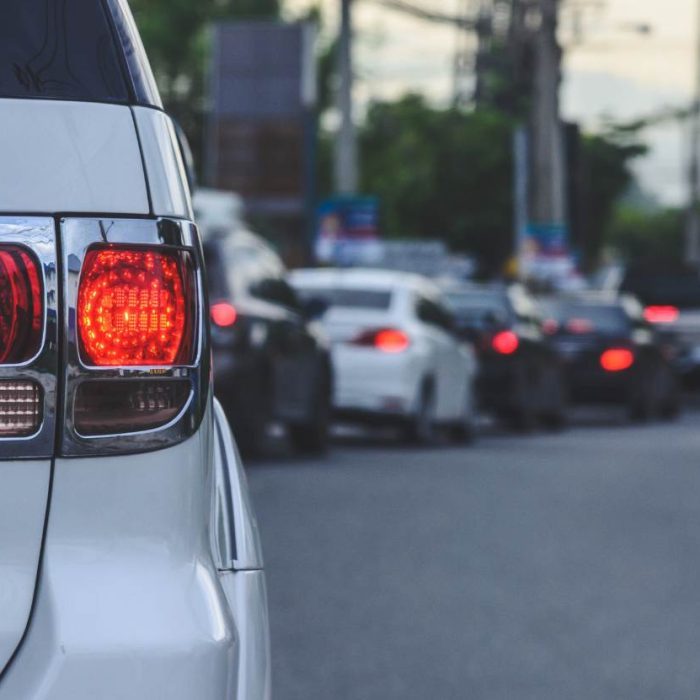 Vehicle driving efficiently on New Zealand highway demonstrating smooth driving for better fuel economy.
