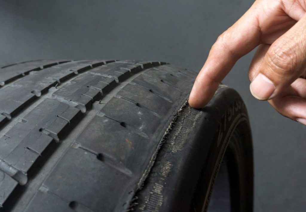 Vehicle displaying uneven tyre tread - needing wheel alignment