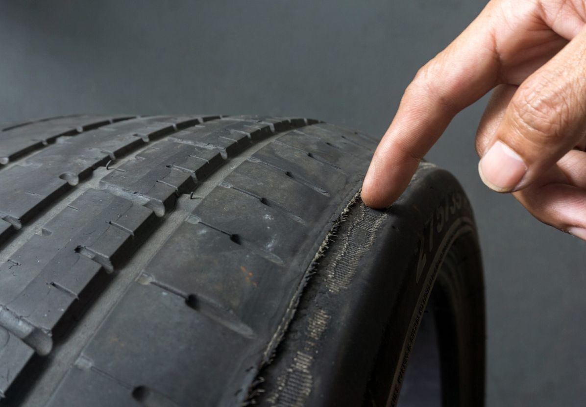 Vehicle displaying uneven tyre tread - needing wheel alignment